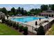 The community pool, surrounded by lounge chairs and umbrellas, is a great place to relax at 427 Cedar Pond Ct, Knightdale, NC 27545