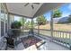 Inviting screened-in porch with comfortable seating and views of the serene backyard at 427 Cedar Pond Ct, Knightdale, NC 27545