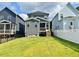 Well-manicured backyard featuring a screened porch, perfect for outdoor relaxation and entertaining at 513 Basin Hill Dr, Wake Forest, NC 27587