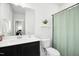 Bathroom featuring a vanity with black cabinets, white countertops, and a walk-in shower at 513 Basin Hill Dr, Wake Forest, NC 27587