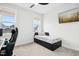 Cozy bedroom features a twin bed, large window and a ceiling fan at 513 Basin Hill Dr, Wake Forest, NC 27587