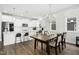 Bright kitchen and dining area with modern appliances and stylish lighting fixtures at 513 Basin Hill Dr, Wake Forest, NC 27587