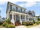 Beautiful two-story home with a covered porch and manicured landscaping at 513 Basin Hill Dr, Wake Forest, NC 27587