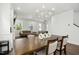 Open concept living and dining area with hardwood floors, fireplace and decorative table pieces at 513 Basin Hill Dr, Wake Forest, NC 27587