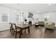 Spacious living room with fireplace, built-in shelving and television. Large windows provide plenty of natural light at 513 Basin Hill Dr, Wake Forest, NC 27587