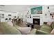 Open-concept living room featuring a fireplace, built-ins, and seamless kitchen access at 513 Basin Hill Dr, Wake Forest, NC 27587