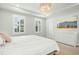 Inviting main bedroom with neutral decor, large windows, and plenty of natural light at 513 Basin Hill Dr, Wake Forest, NC 27587