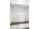 Mudroom area featuring a built-in bench with hooks and storage, perfect for organization at 513 Basin Hill Dr, Wake Forest, NC 27587