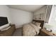 Cozy bedroom with a queen bed, dresser, and decoratively lit side table at 528 Folk Song Way, Wendell, NC 27591