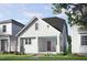 Charming craftsman-style home with white board and batten siding, inviting porch, and red front door at 528 Folk Song Way, Wendell, NC 27591