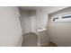 A neutral hallway features an accessible staircase and large window at 528 Folk Song Way, Wendell, NC 27591