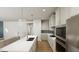 Bright, modern kitchen featuring a spacious island, stainless steel appliances, and ample cabinet space at 528 Folk Song Way, Wendell, NC 27591