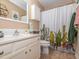 Bright bathroom features a white vanity and a unique cactus-themed shower curtain at 5536 Centipede Trl, Raleigh, NC 27610