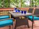 Close up of the dining table set on the outdoor deck with surrounding trees at 5536 Centipede Trl, Raleigh, NC 27610