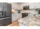 Modern kitchen features stainless steel appliances, granite countertops, and subway tile backsplash at 5536 Centipede Trl, Raleigh, NC 27610
