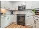 Kitchen area featuring granite countertops, subway tile backsplash, and modern appliances at 5536 Centipede Trl, Raleigh, NC 27610
