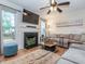 Comfortable living room with a fireplace, wainscotting, and a plush sectional sofa at 5536 Centipede Trl, Raleigh, NC 27610