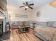Spacious living room features a ceiling fan, board and batten trim, and hardwood floors at 5536 Centipede Trl, Raleigh, NC 27610