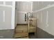 Bright basement area shows a small water heater and wooden steps at 5649 Cayden Cove Dr, Wendell, NC 27591