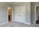 Bedroom with carpeted floor and closet featuring ensuite bathroom at 5649 Cayden Cove Dr, Wendell, NC 27591