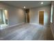 A spacious bedroom with neutral carpet and multiple entryways at 5649 Cayden Cove Dr, Wendell, NC 27591