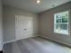 Bedroom with carpeted floor, closet with double doors, and a window at 5649 Cayden Cove Dr, Wendell, NC 27591