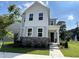 Beautiful two-story home with a stone facade, manicured lawn, and welcoming entrance at 5649 Cayden Cove Dr, Wendell, NC 27591