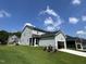 Rear exterior of home showing siding, garage, and screen porch at 5649 Cayden Cove Dr, Wendell, NC 27591