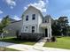 Charming two-story home with a stone facade and well-manicured lawn at 5649 Cayden Cove Dr, Wendell, NC 27591