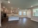 Modern kitchen with stainless steel appliances, island, and plenty of natural light at 5649 Cayden Cove Dr, Wendell, NC 27591