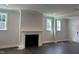 Cozy living area featuring a fireplace, recessed lighting, and natural light at 5649 Cayden Cove Dr, Wendell, NC 27591