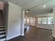 Spacious living room with hardwood floors, recessed lighting, and staircase at 5649 Cayden Cove Dr, Wendell, NC 27591