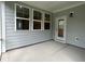 Covered patio with gray siding, white trim, and neutral flooring at 5649 Cayden Cove Dr, Wendell, NC 27591
