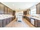 Modern kitchen featuring stainless steel appliances, island, and stylish tile backsplash at 589 Atkinson Mill Rd, Selma, NC 27576