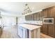 Modern kitchen with island, stainless appliances, and stylish backsplash at 589 Atkinson Mill Rd, Selma, NC 27576