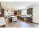 Gourmet kitchen featuring stainless appliances, center island, and custom tile backsplash at 589 Atkinson Mill Rd, Selma, NC 27576