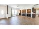 Spacious open floor plan living room with light walls, tile floors, and natural light at 589 Atkinson Mill Rd, Selma, NC 27576