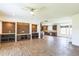 Open concept living space featuring wood-look tile floors and a custom wood accent wall at 589 Atkinson Mill Rd, Selma, NC 27576