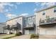 Townhome exterior showing garages, balconies, and neutral-colored siding at 6107 Kayton St, Raleigh, NC 27616