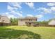 Spacious backyard view shows the home's back exterior and wooden fence surrounding the property at 642 Pinevalley Ln, Sanford, NC 27332
