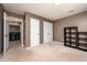 Empty bedroom with a view to the laundry room with neutral walls and carpet at 642 Pinevalley Ln, Sanford, NC 27332