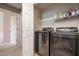 A laundry room with a modern washer and dryer set, and wire shelving for storage at 642 Pinevalley Ln, Sanford, NC 27332