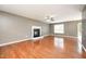 Spacious living room featuring hardwood floors and a classic fireplace, creating a cozy atmosphere at 642 Pinevalley Ln, Sanford, NC 27332