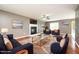 Living room with hardwood floors, fireplace, and coordinated furniture for a comfortable space at 642 Pinevalley Ln, Sanford, NC 27332