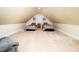 Open bonus room featuring twin beds, soft carpet, and natural light from the window at 65 Shorrey Pl, Youngsville, NC 27596