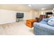 Comfortable bonus room with plush seating, television, and ample space for relaxation and entertainment at 65 Shorrey Pl, Youngsville, NC 27596