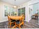 Cozy dining area featuring lots of natural light, round table, and sliding door access at 65 Shorrey Pl, Youngsville, NC 27596