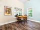 Bright dining area featuring hardwood floors and natural light from dual windows at 65 Shorrey Pl, Youngsville, NC 27596