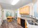 Charming kitchen with stainless steel appliances, granite countertops and wood cabinetry at 65 Shorrey Pl, Youngsville, NC 27596