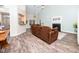 Cozy living room with high ceilings, a warm fireplace, and comfortable furnishings at 65 Shorrey Pl, Youngsville, NC 27596